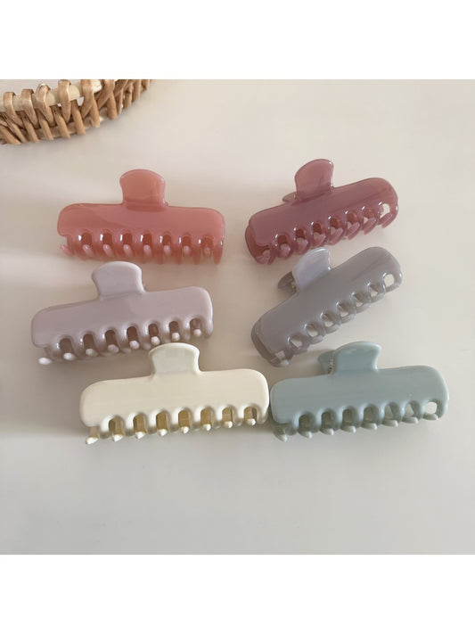 Beau colorful rectangular hair clip in pastel pink on white background