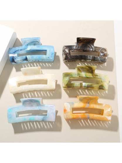 Beau rectangular hair clip with a glossy tortoiseshell pattern on a white background