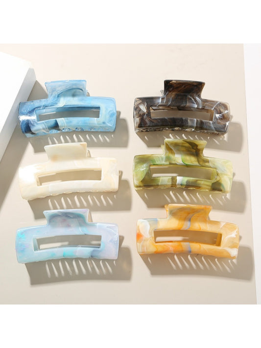 Beau rectangular hair clip with a glossy tortoiseshell pattern on a white background