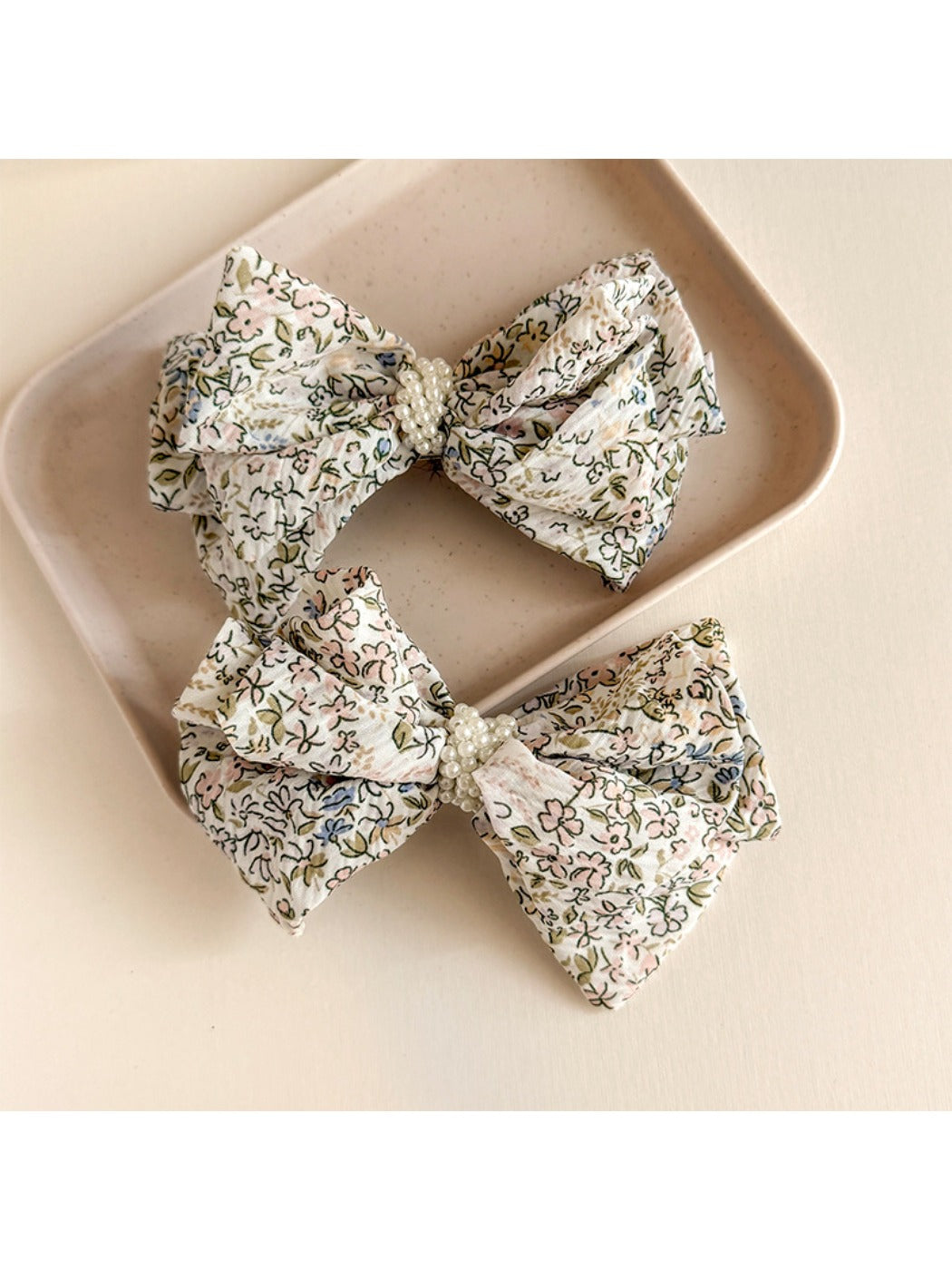 Beau Bow Tiny Floral Snap Hair Clip shown clipped on blonde hair