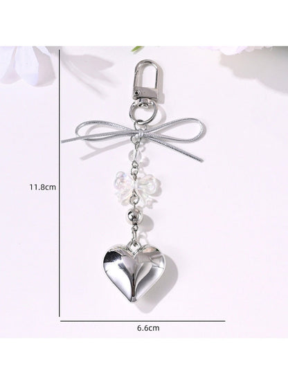 Close-up of Keypus bow keychain showing detailed star and heart shapes