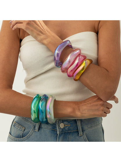 Close-up of Lovra bangle bracelet showing multicolored irregular shapes