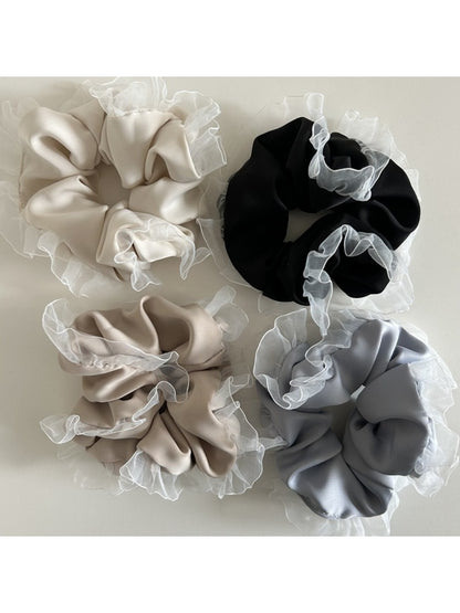 Side view of Gifty vintage tulle ruffle scrunchie showing layered ruffles