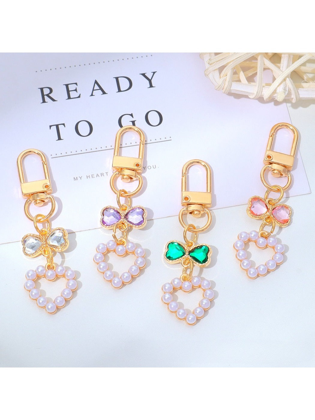 Close-up of a cute beaded heart keychain with pastel-colored beads
