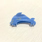 Beau starfish and conch claw clip resting on sandy beach background