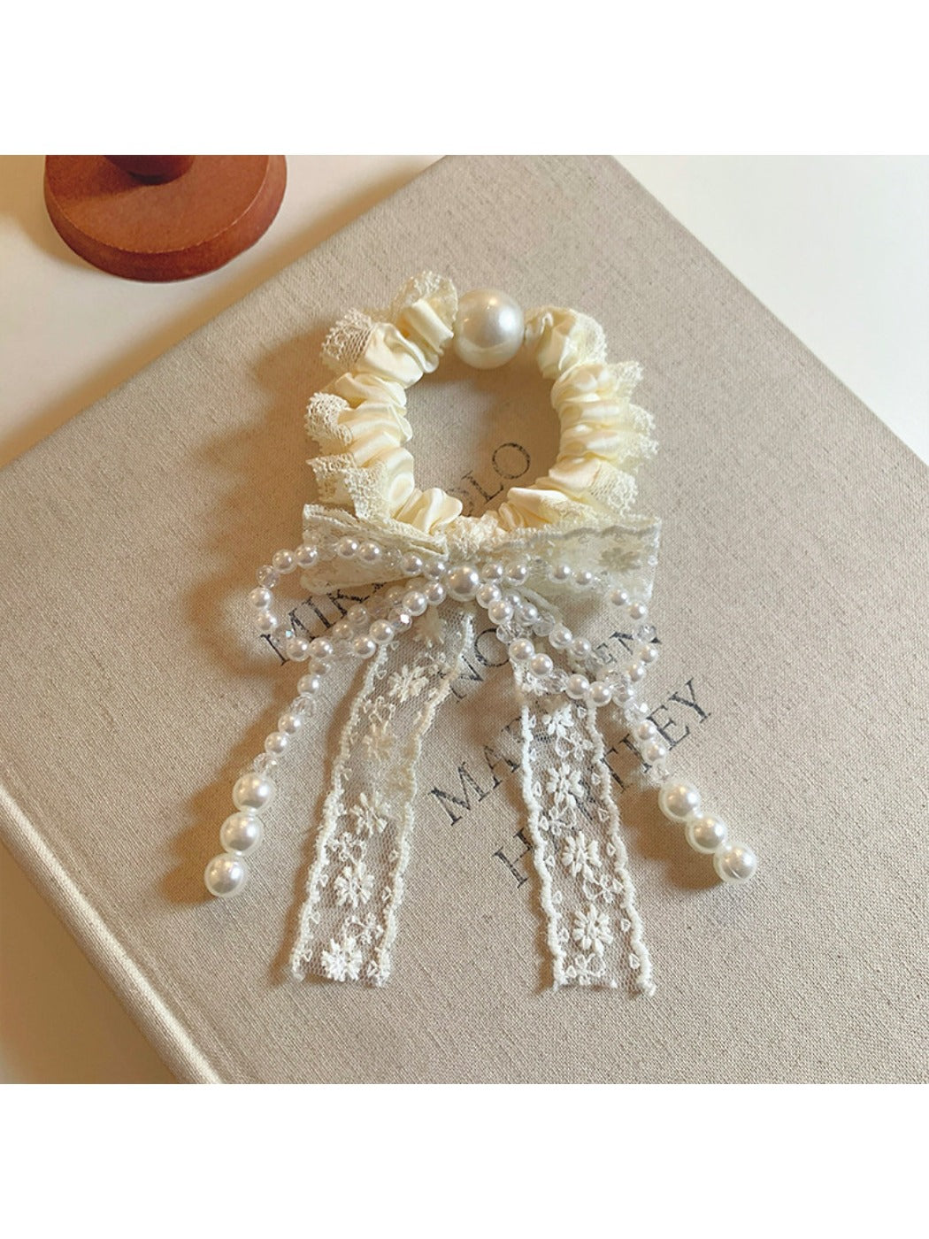 Gifty Sweet Beaded Bow Hair Tie displayed on a white background showing bow detail