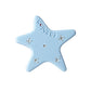 Beau acetate star hair clip held in hand showing size