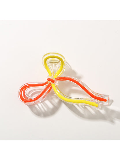 Top view of Beau Sweet Ribbon Knot Hair Clip showing symmetrical ribbon knot design