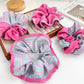 Close-up of magenta and pink striped scrunchie fabric texture