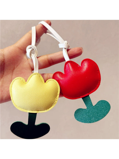 Side view of the pink tulip bag charm showing petal details