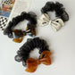 Gifty mesh bow acetate scrunchie displayed on a white background