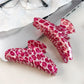 Close-up of Beau pink leopard print half round claw clip showing pattern details