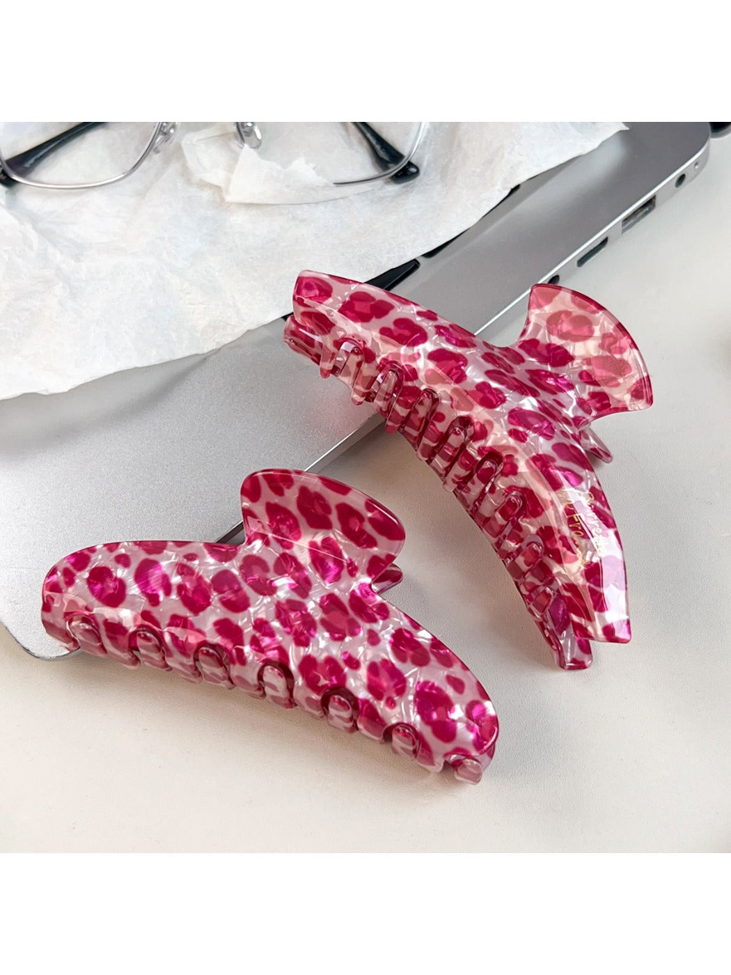 Close-up of Beau pink leopard print half round claw clip showing pattern details