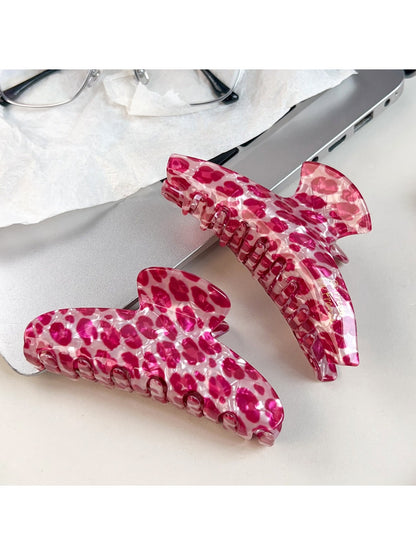 Close-up of Beau pink leopard print half round claw clip showing pattern details