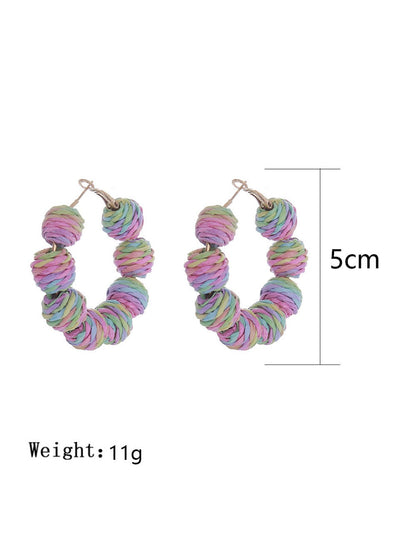 Earedge vintage raffia round ball drop earrings displayed hanging on a stand