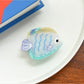 Beau tropical fish hair clip styled in model's hair showcasing accessory use