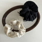 Gifty scrunchie styled on a ponytail with layered chiffon bow in light pink
