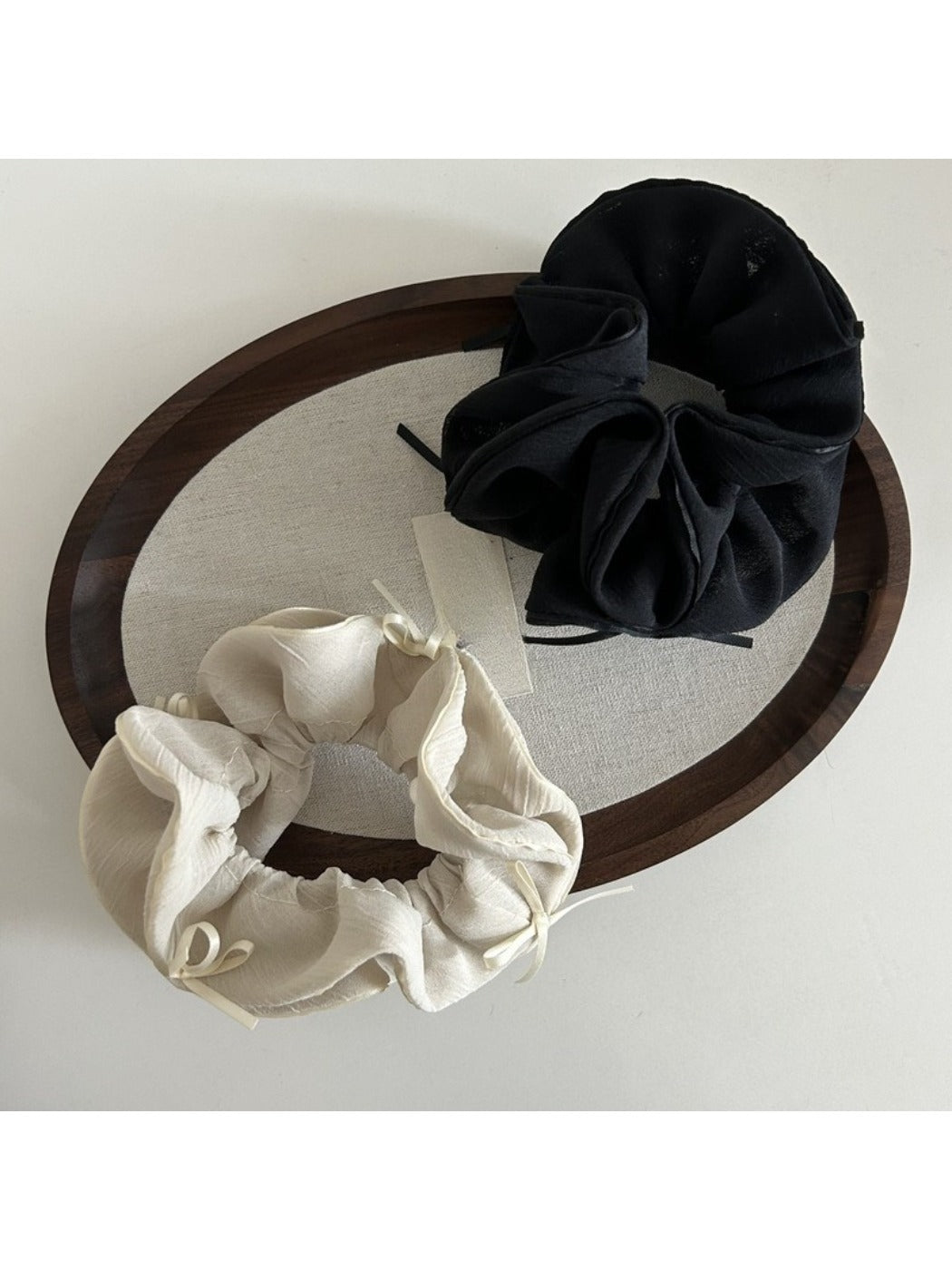 Gifty scrunchie styled on a ponytail with layered chiffon bow in light pink