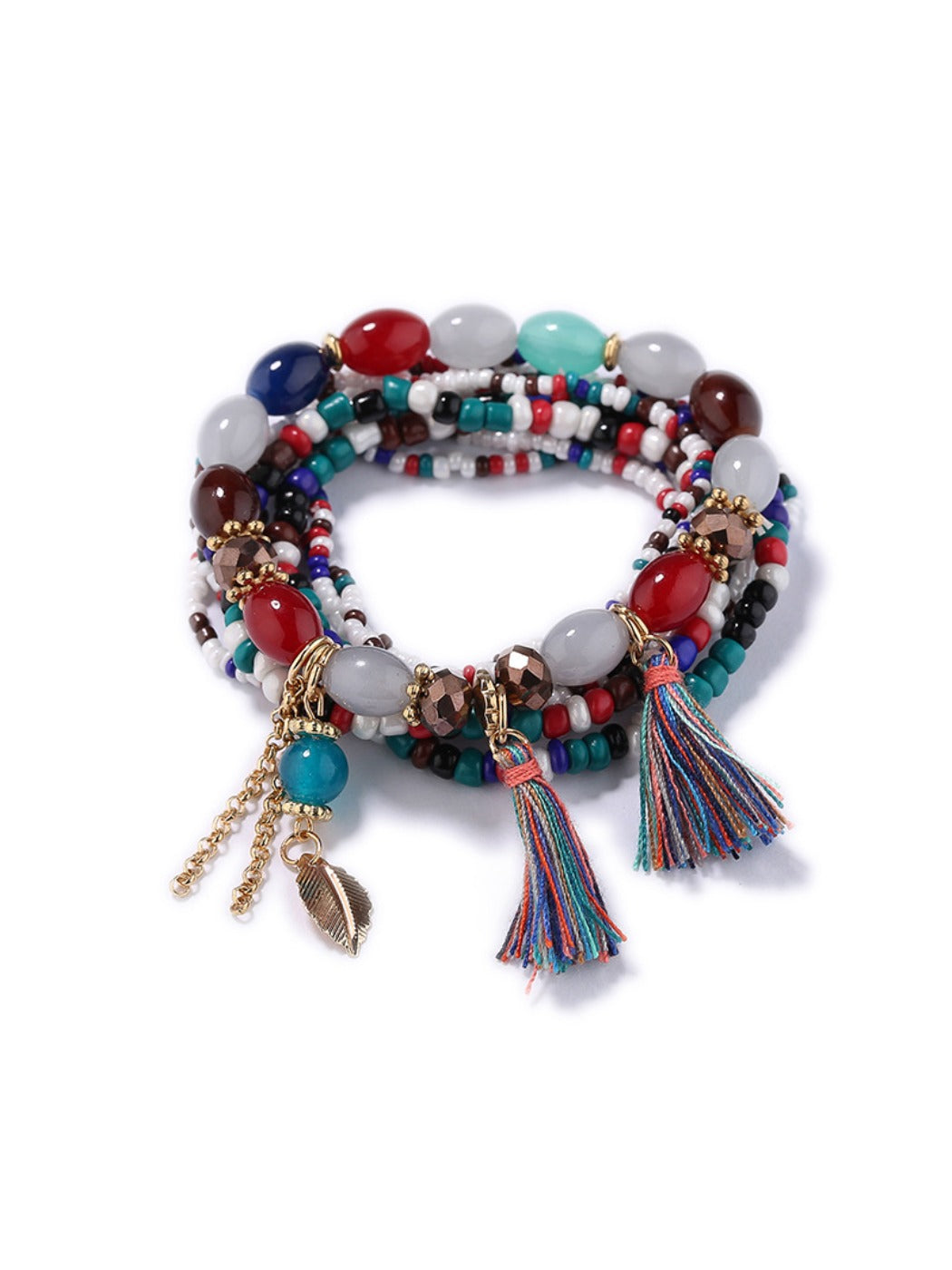 Detailed shot of Lovra bracelet tassel pendant with gold-tone finish and beads