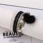 Lovra bracelet styled with casual outfit showing pompom pendant and beads