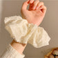 Close-up of ruched texture on Gifty pastel pink scrunchie