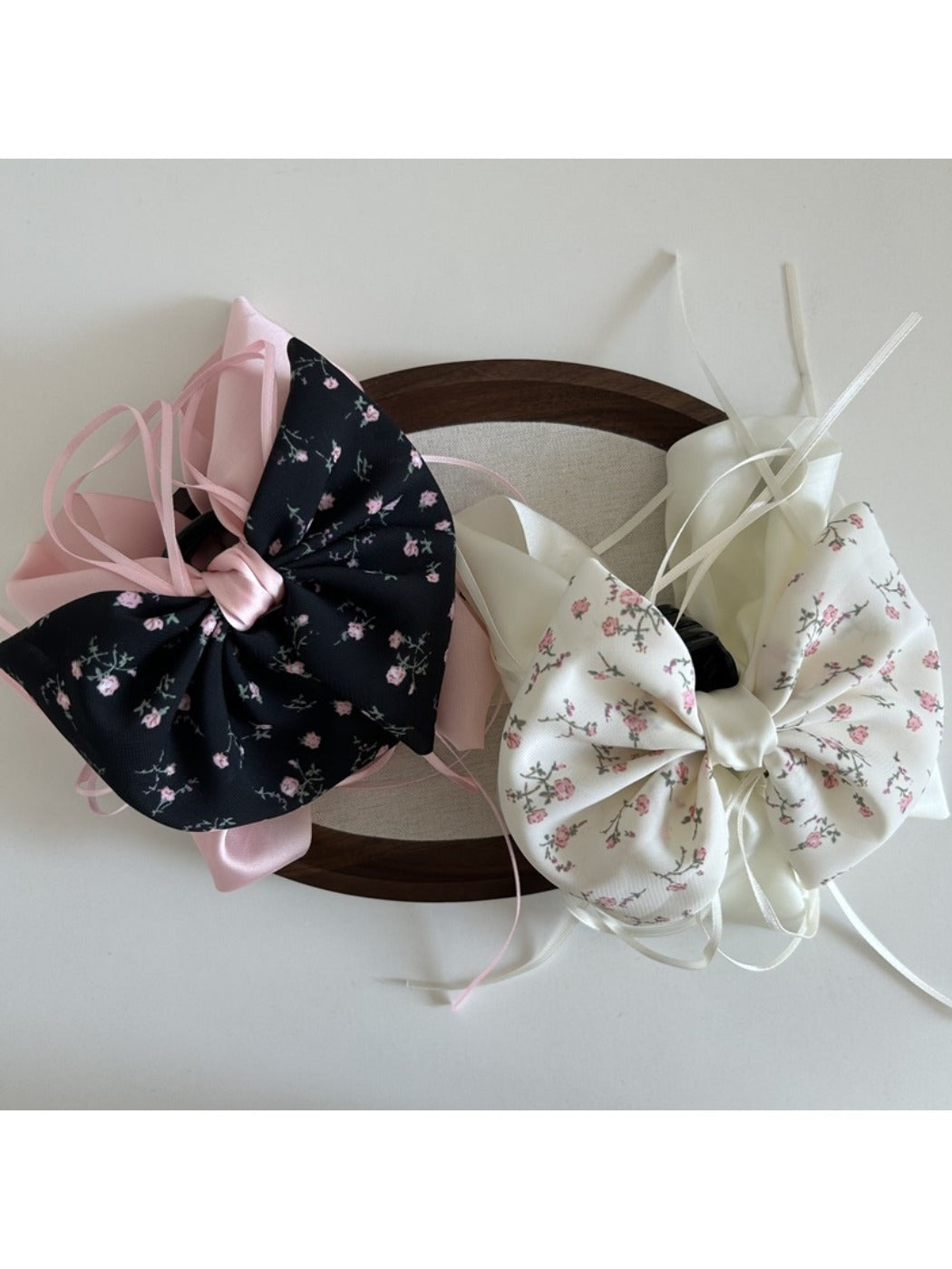 Side view of Beau Sweet Tiny Floral Bow Claw Clip displaying bow shape