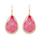 Earedge Cord Woven Teardrop Earrings worn by a model with short hair