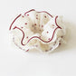 Gifty vintage polka dot scrunchie displayed on a white background