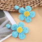 Earedge flower shaped drop earrings photographed with natural lighting