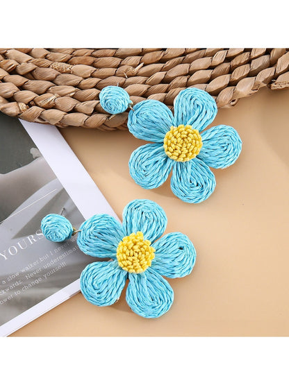 Earedge flower shaped drop earrings photographed with natural lighting
