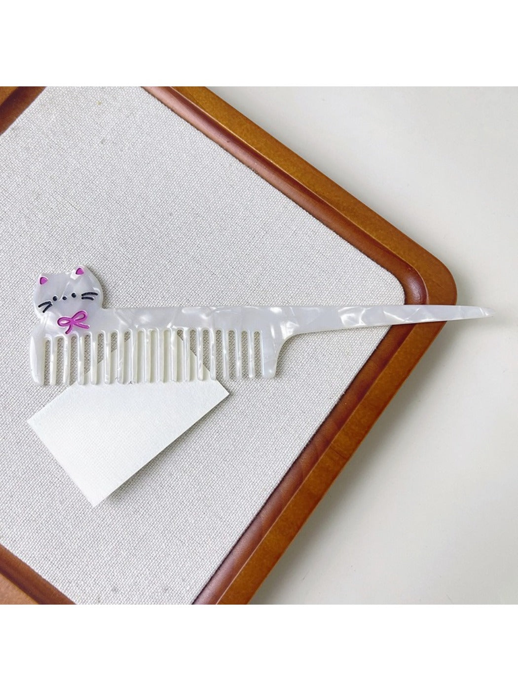 Camerow acetate hair comb displayed alongside hair styling accessories