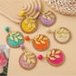 Close-up of Earedge round leaf pendant earrings in gold finish