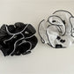 Fresh elegant scrunchie styled on a wrist with natural lighting