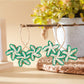 Earedge Sweet Flower Shaped Drop Earrings shown in a gift box with soft lighting