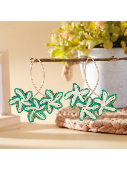 Earedge Sweet Flower Shaped Drop Earrings shown in a gift box with soft lighting