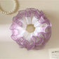 Close-up of Gifty minimalist tulle ruffle scrunchie in soft pink fabric