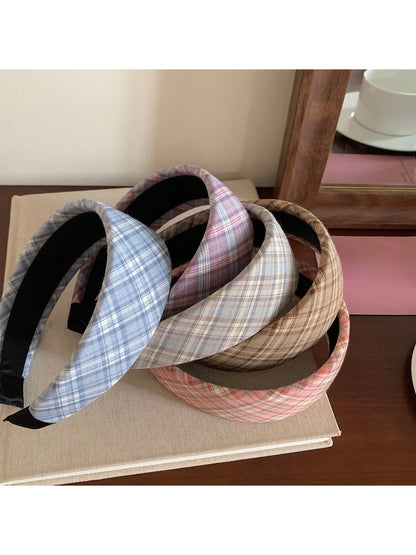 Side view of the wide plaid headband on a model with casual outfit