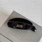 Beau minimalist stick hair clip shown with packaging box on neutral background
