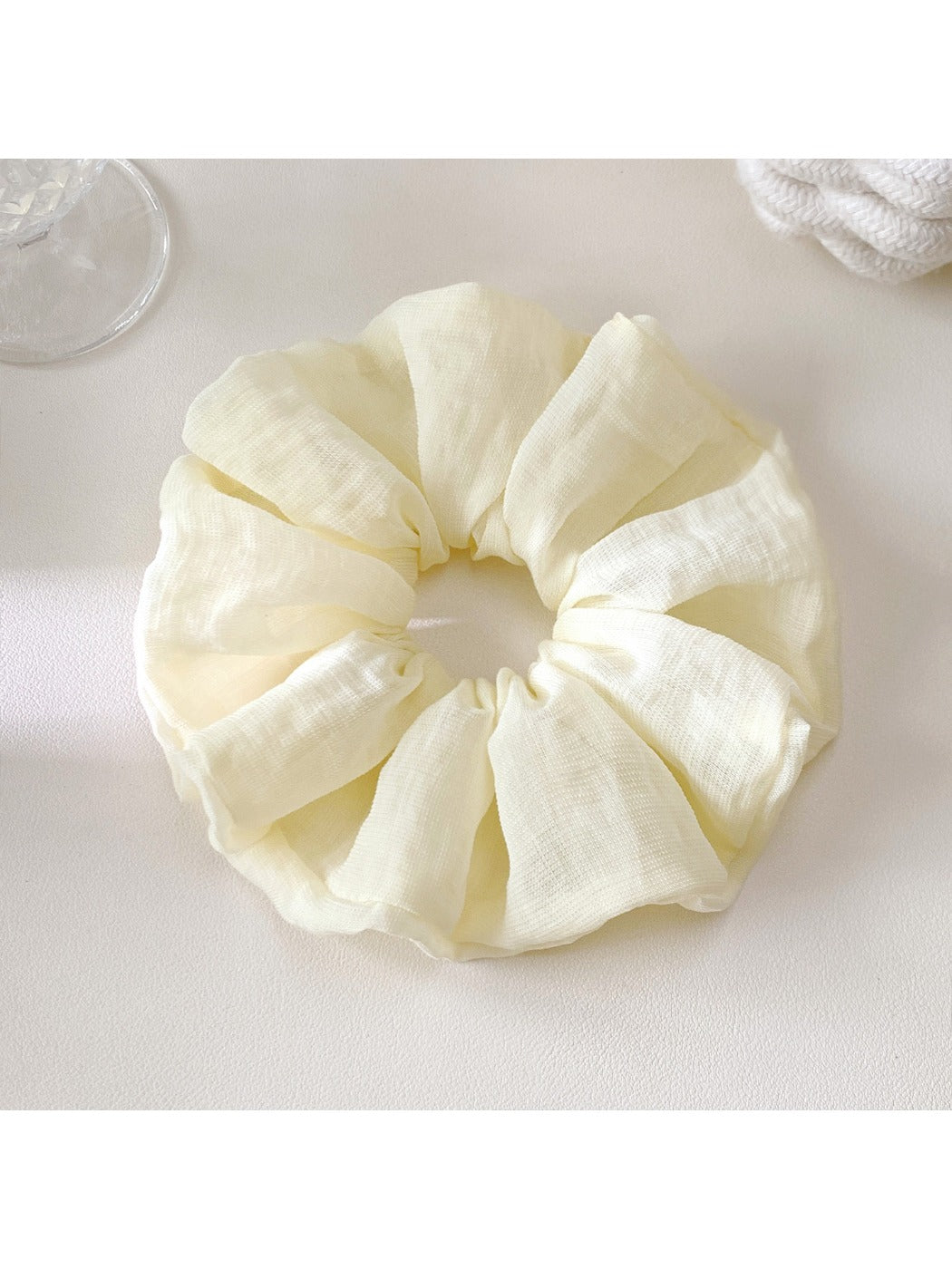 Scrunchie styled on a wrist as a casual accessory with bright colors