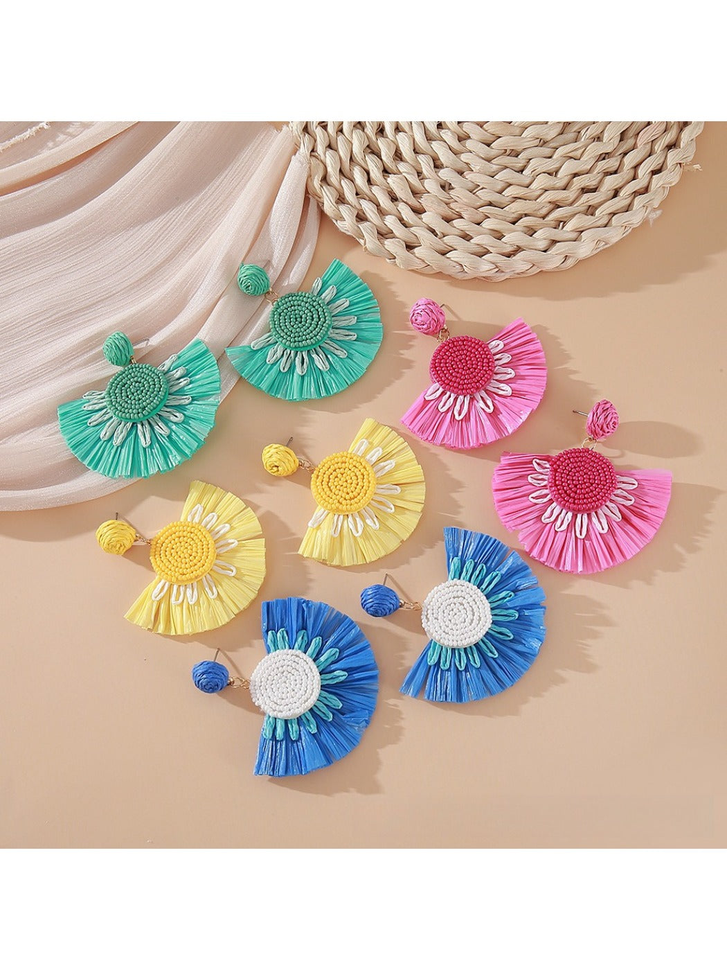 Close-up of Earedge minimalist fan shaped drop earrings on white background