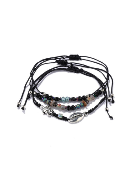 Lovra alloy charm small bead bracelet with clasp visible on a neutral background