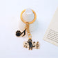 Cartoon cat piano keychain with metal keyring and detailed cat face design