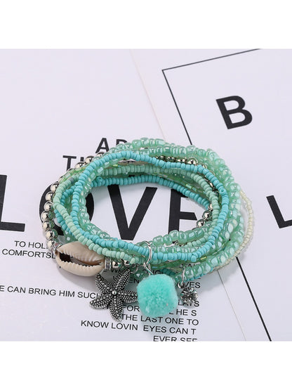 Lovra bracelet close-up showing clasp and small gold and silver beads