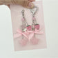 Close-up of pink star keychain showing textured bow detail