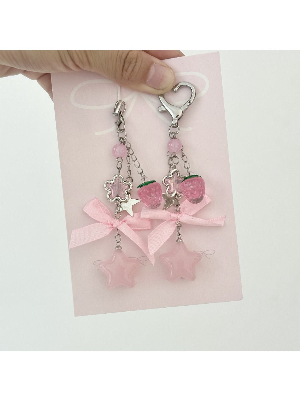 Close-up of pink star keychain showing textured bow detail