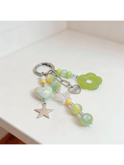 Keypus green beaded keychain displayed with keys on a wooden surface