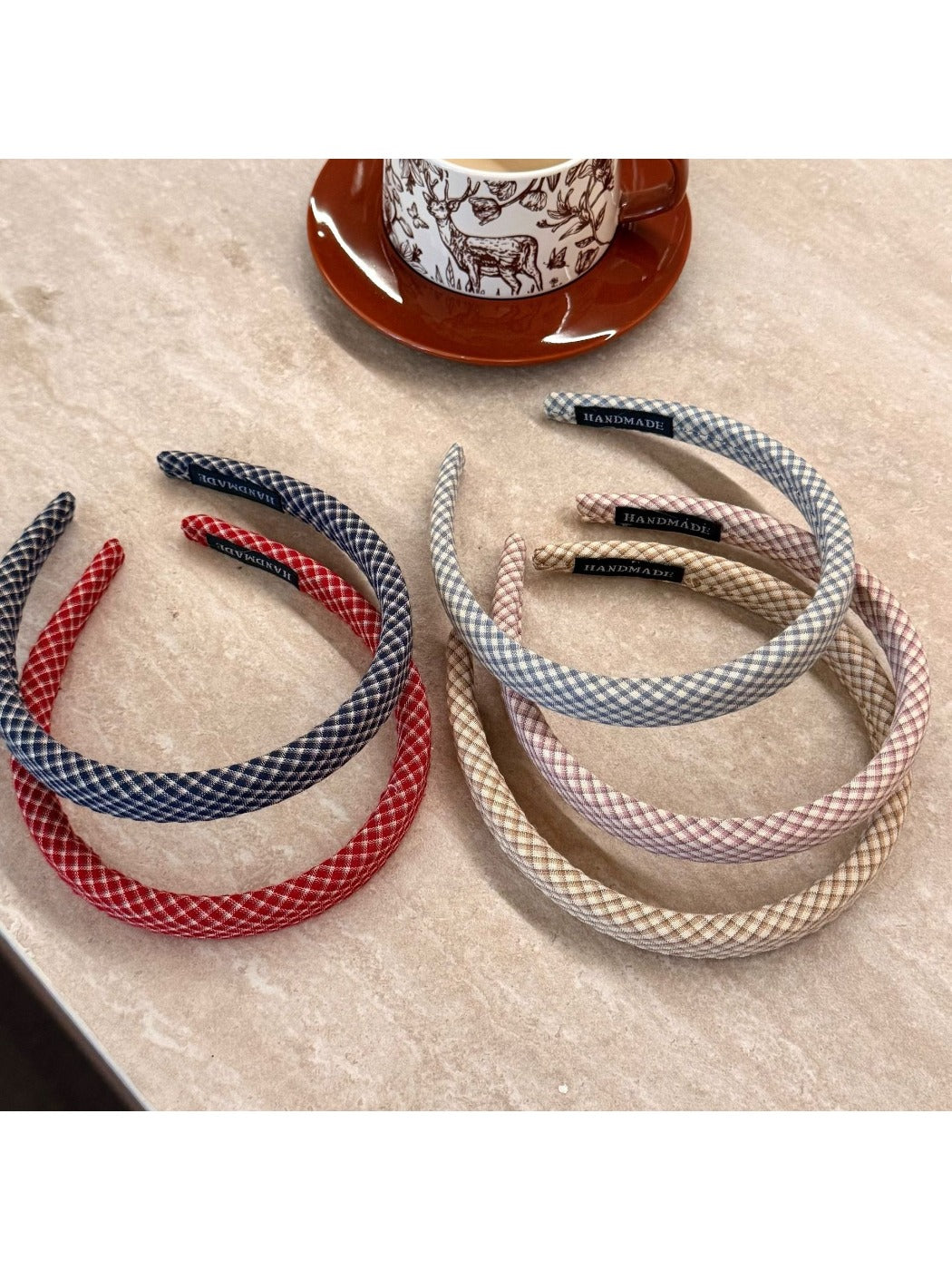 Side view of Gifty minimalist plaid headband highlighting its slim design