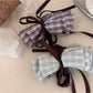 Beau hair clip showing bow design and metal clasp from side angle