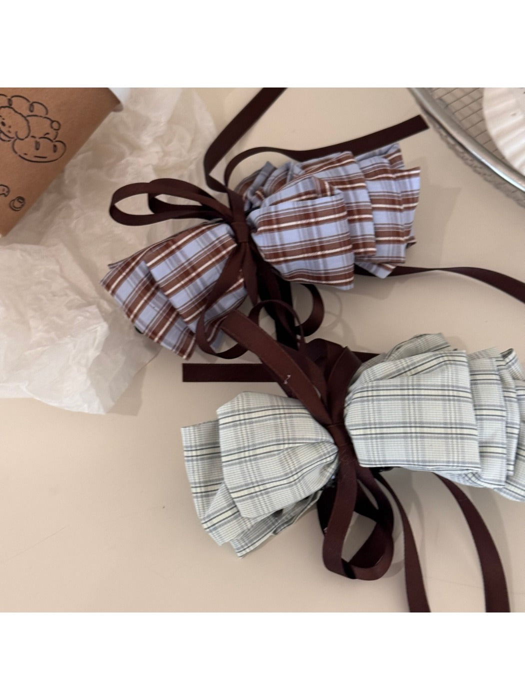Beau hair clip showing bow design and metal clasp from side angle