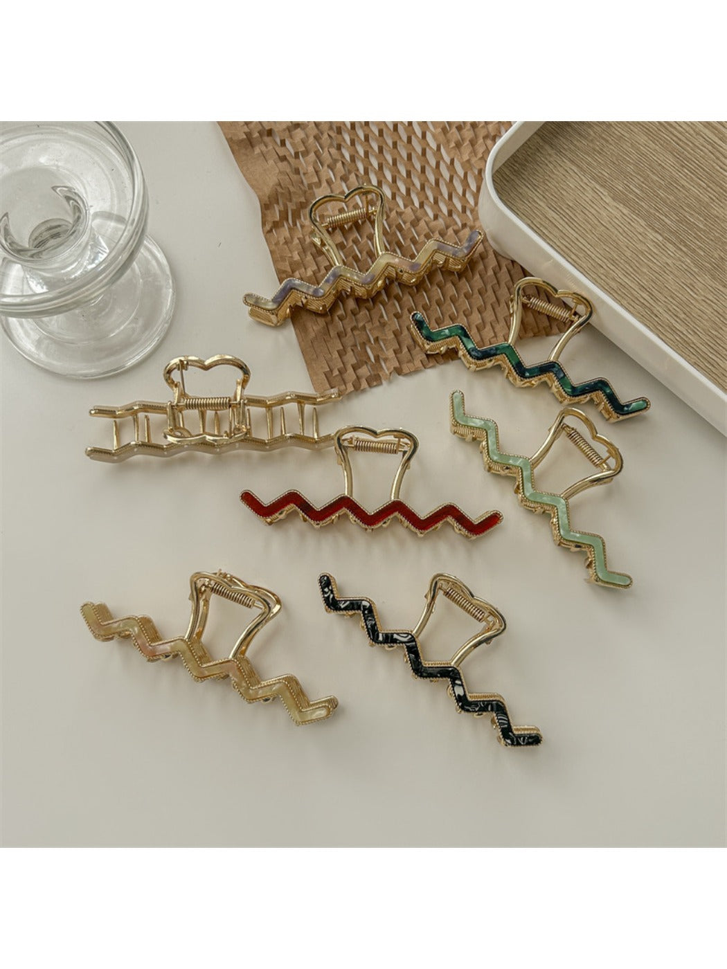 Beau wavy metal claw clip open displaying inner clasp mechanism